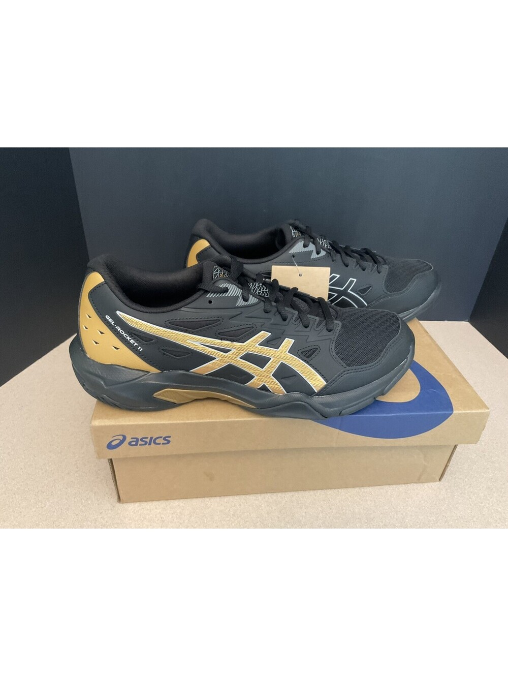 New! Mens ASICS Gel-Rocket 11 Black/Piedmont Grey/Gold Volleyball Shoes. Size 9.